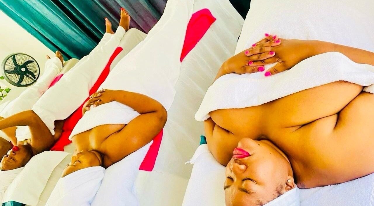 Women relaxing with spa treatments at La Vita E Bella Spa, Johannesburg, Gauteng, ZA, wrapped in white towels.