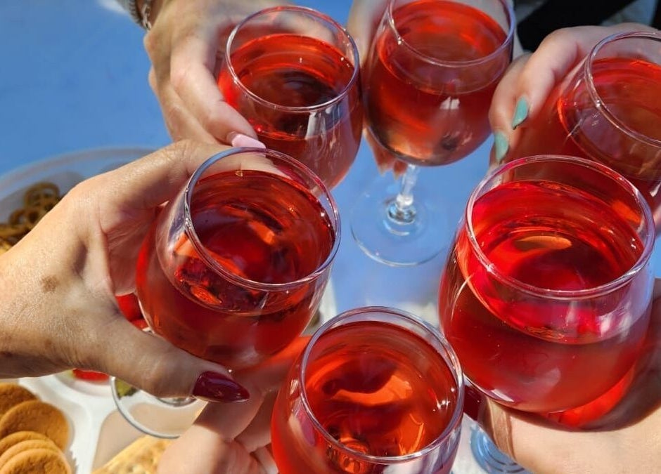 Guests toasting with drinks at La Vita E Bella Spa, Johannesburg, Gauteng, ZA, showcasing relaxation and joy.