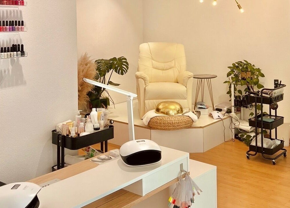 Elegant beauty room at Torico of Beauty in Basel, Basel-stadt, CH featuring a plush chair and mani-pedi tools.