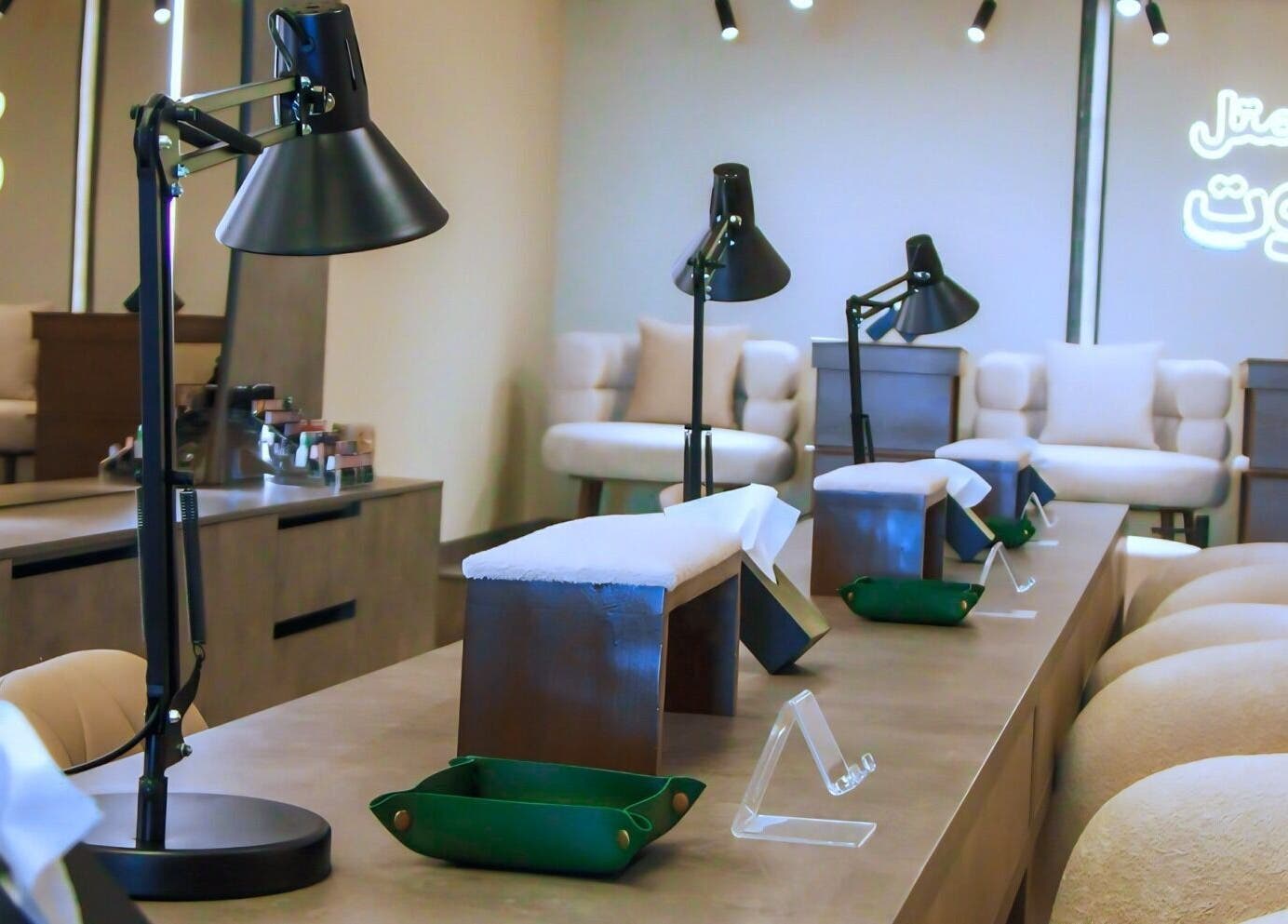 Elegant nail lounge at Beirut Spa, Beirut, Beirut Governorate, LB with modern décor and seating.