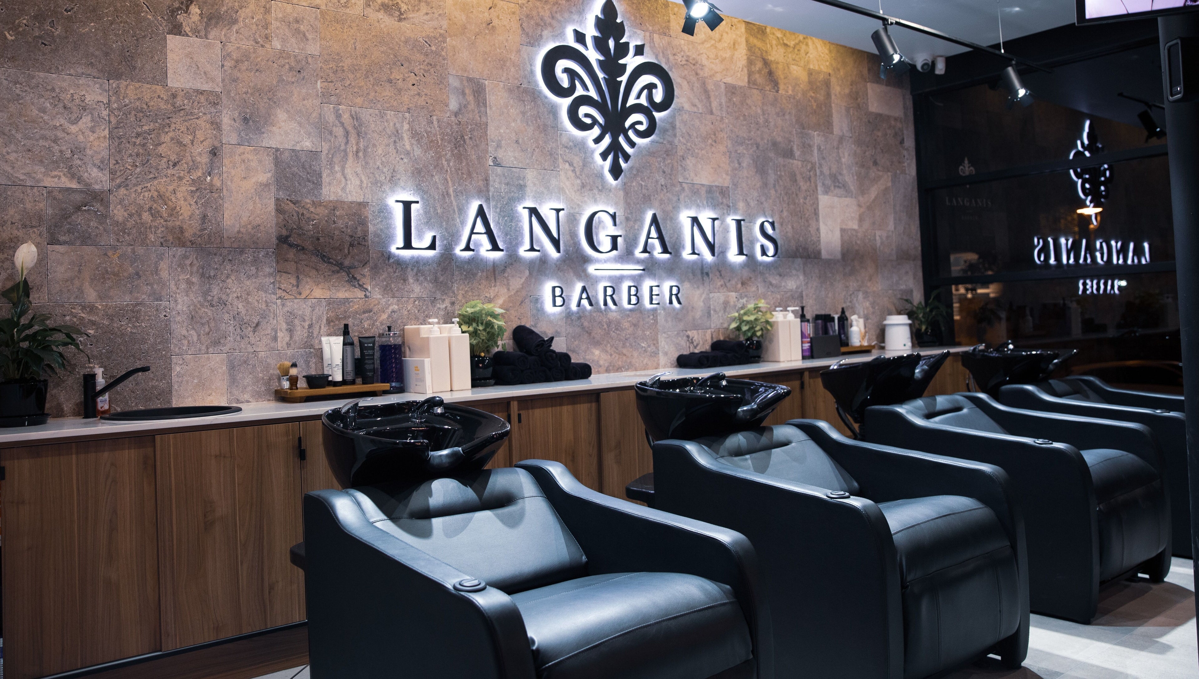 Modern barber chairs at Langanis Studio in Teneriffe, Queensland, AU, offering premium grooming services.