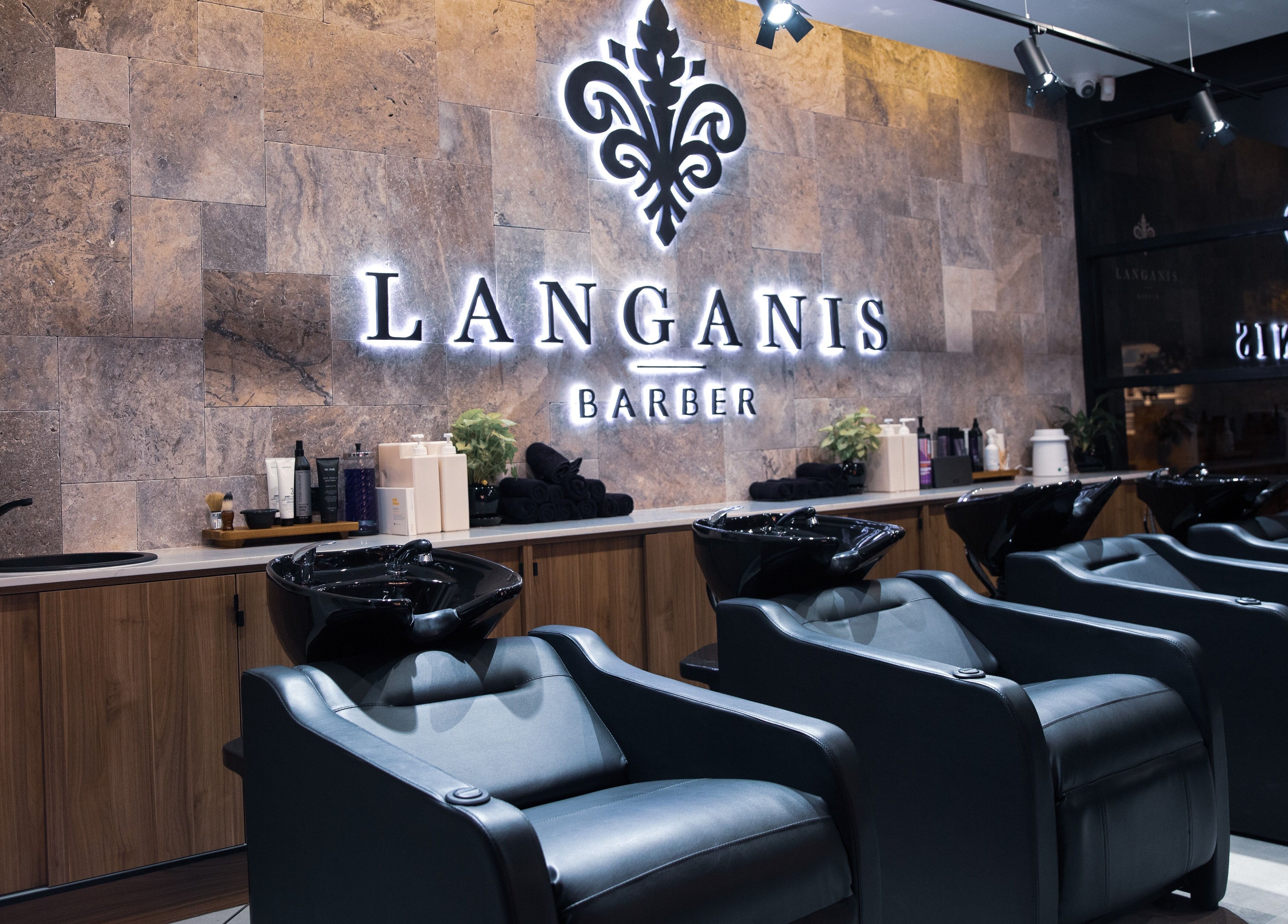 Modern barber chairs at Langanis Studio in Teneriffe, Queensland, AU, offering premium grooming services.