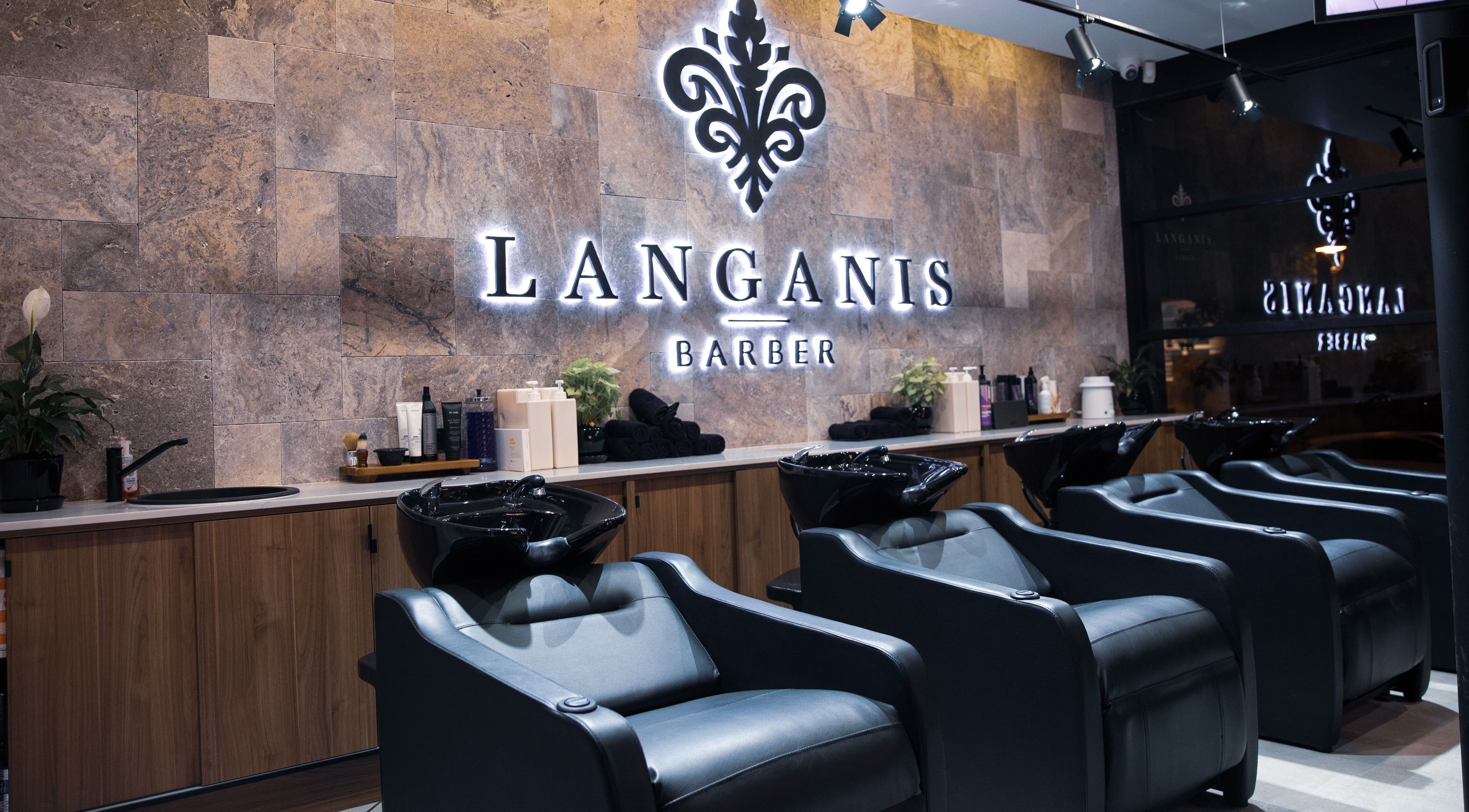 Modern barber chairs at Langanis Studio in Teneriffe, Queensland, AU, offering premium grooming services.