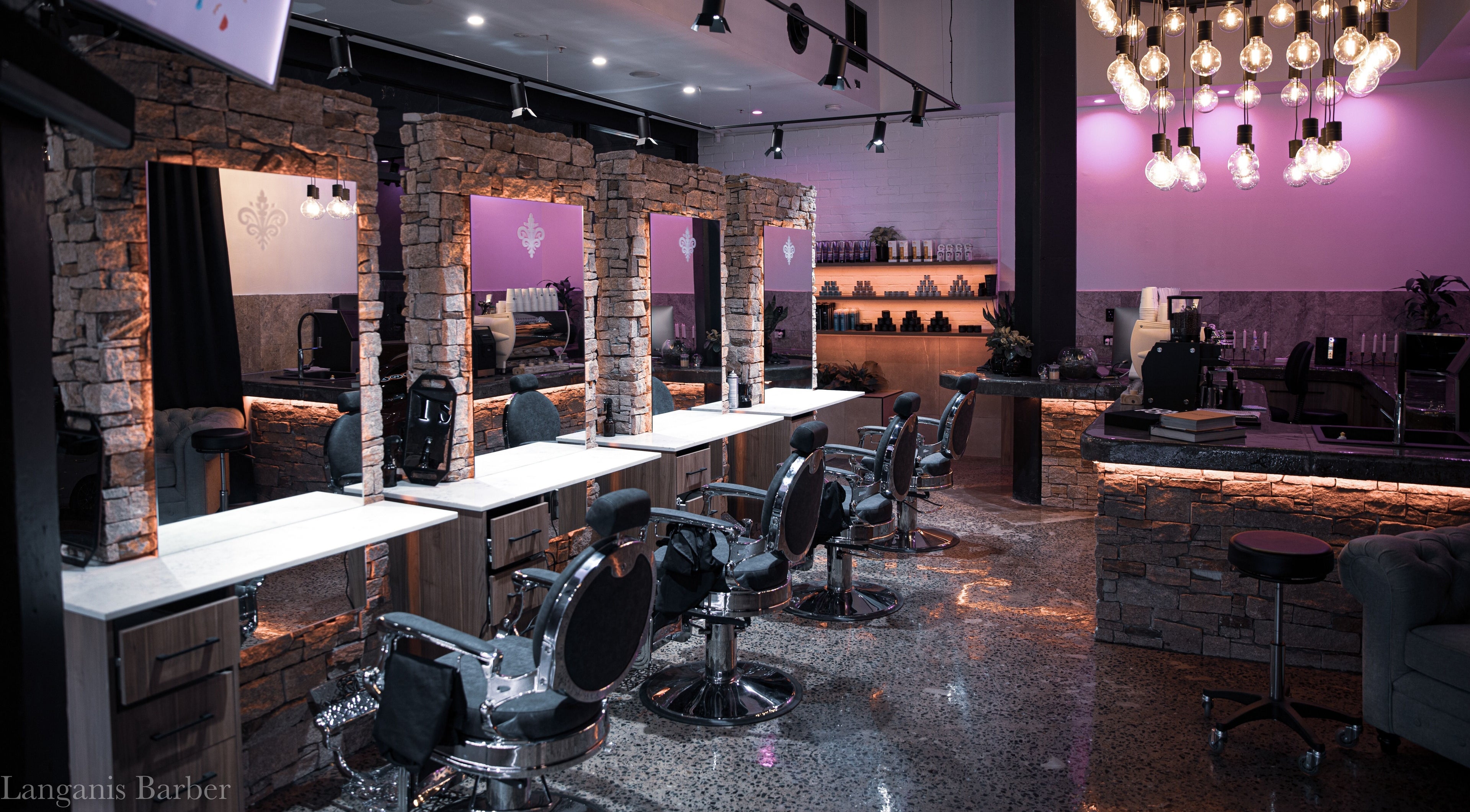 Stylish interior of Langanis Studio in Teneriffe, Queensland, AU, showcasing modern salon chairs and elegant lighting.