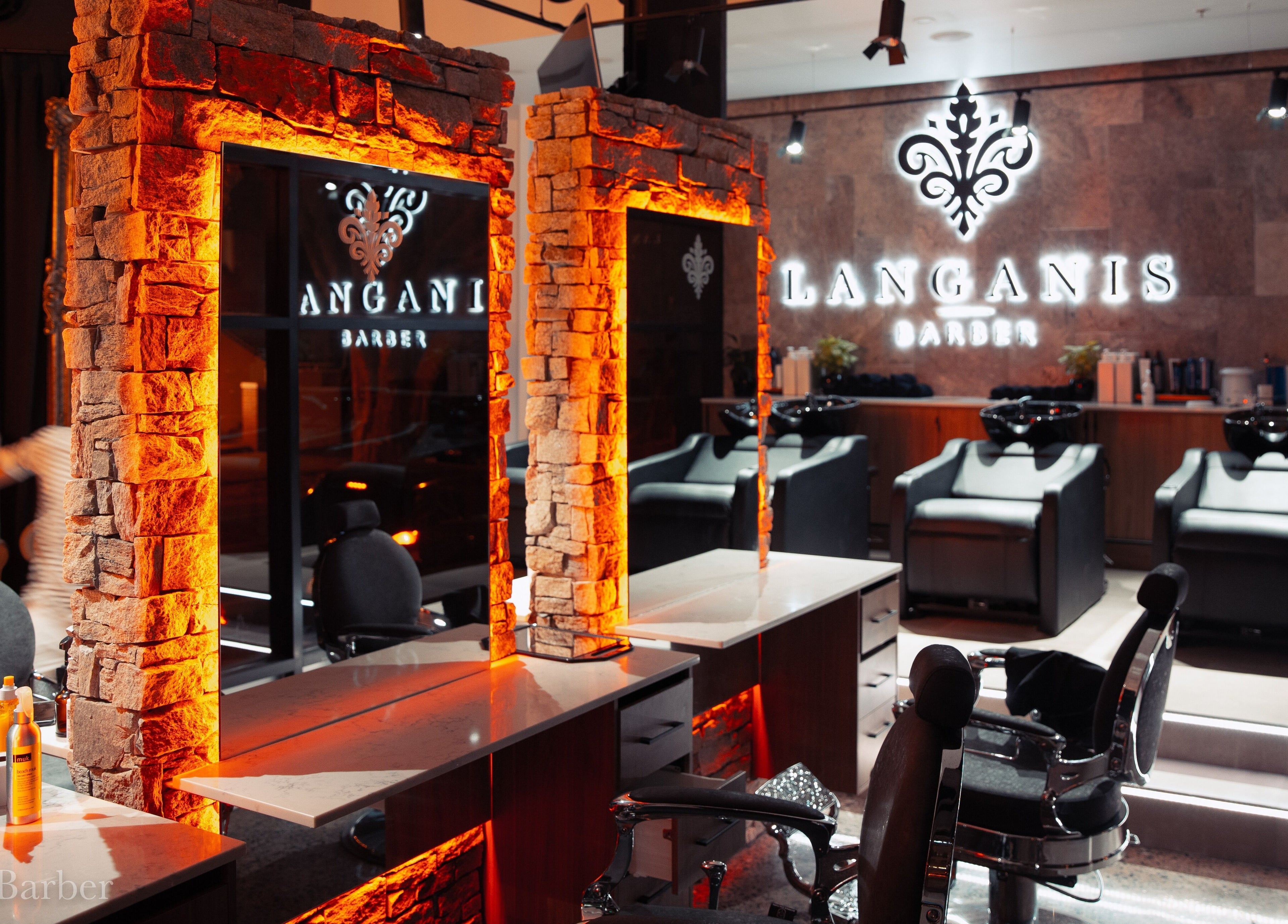 Luxurious interior of Langanis Studio in Teneriffe, Queensland, AU showcasing stylish salon stations and lighting.