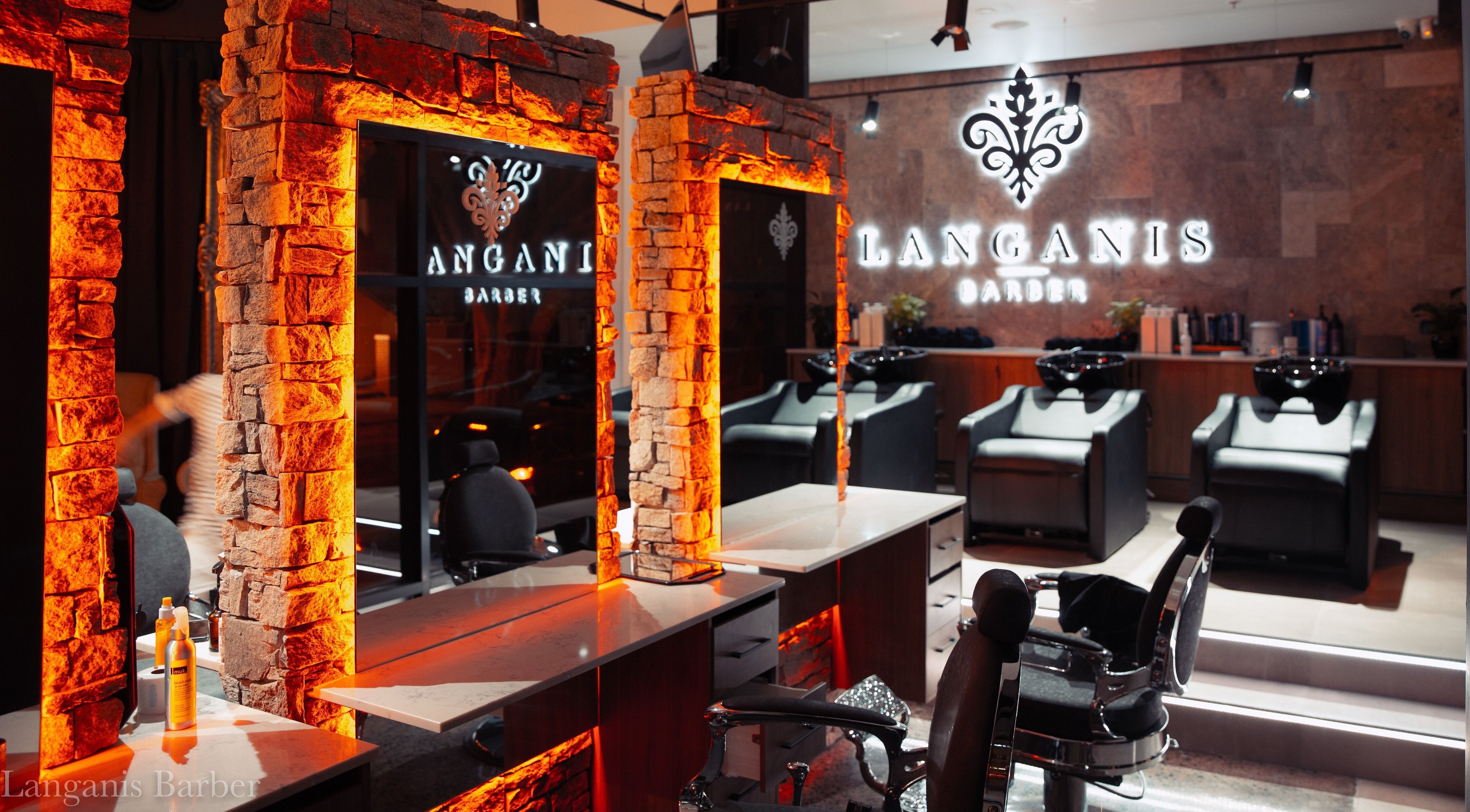 Luxurious interior of Langanis Studio in Teneriffe, Queensland, AU showcasing stylish salon stations and lighting.