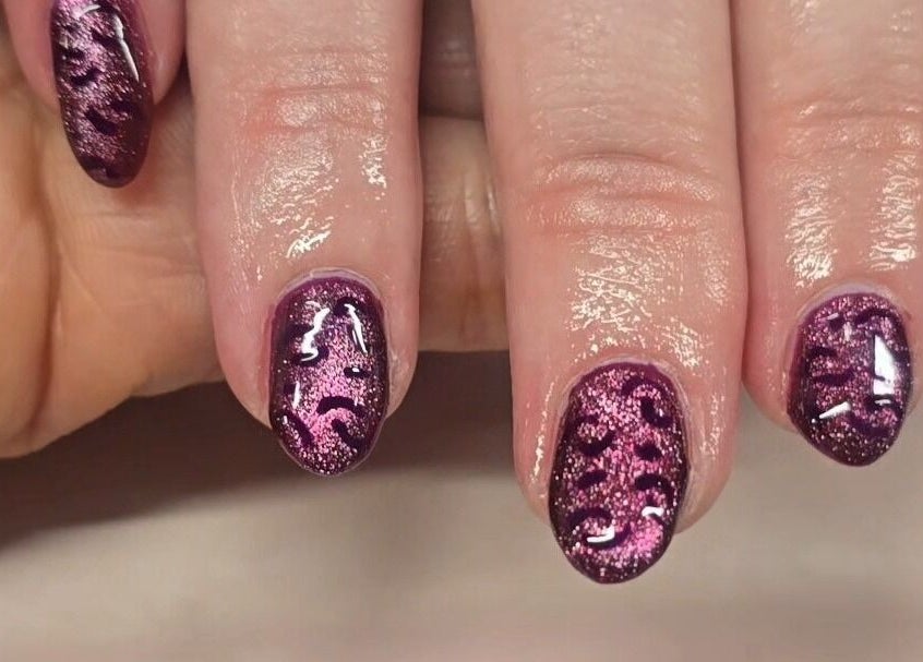Stylish purple glitter nail design at The Pamper Room, Cheadle, England, GB.