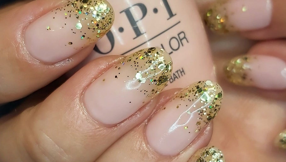 Stylish gold glitter nails at Hands & Heals by Tanya, Hamilton, Ontario, CA.
