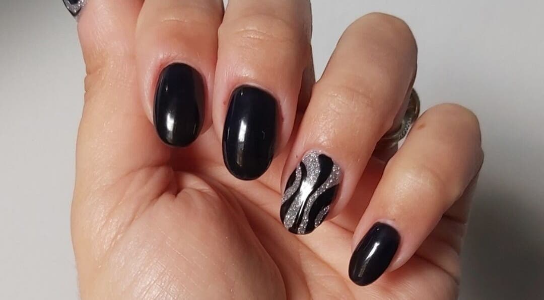 Black nails with silver wave design at Hands & Heals by Tanya, Hamilton, Ontario, CA.
