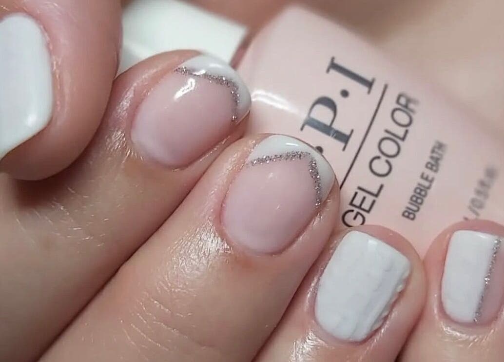 Elegant nail art at Hands & Heals by Tanya in Hamilton, Ontario, CA. Features soft pink and white polish.