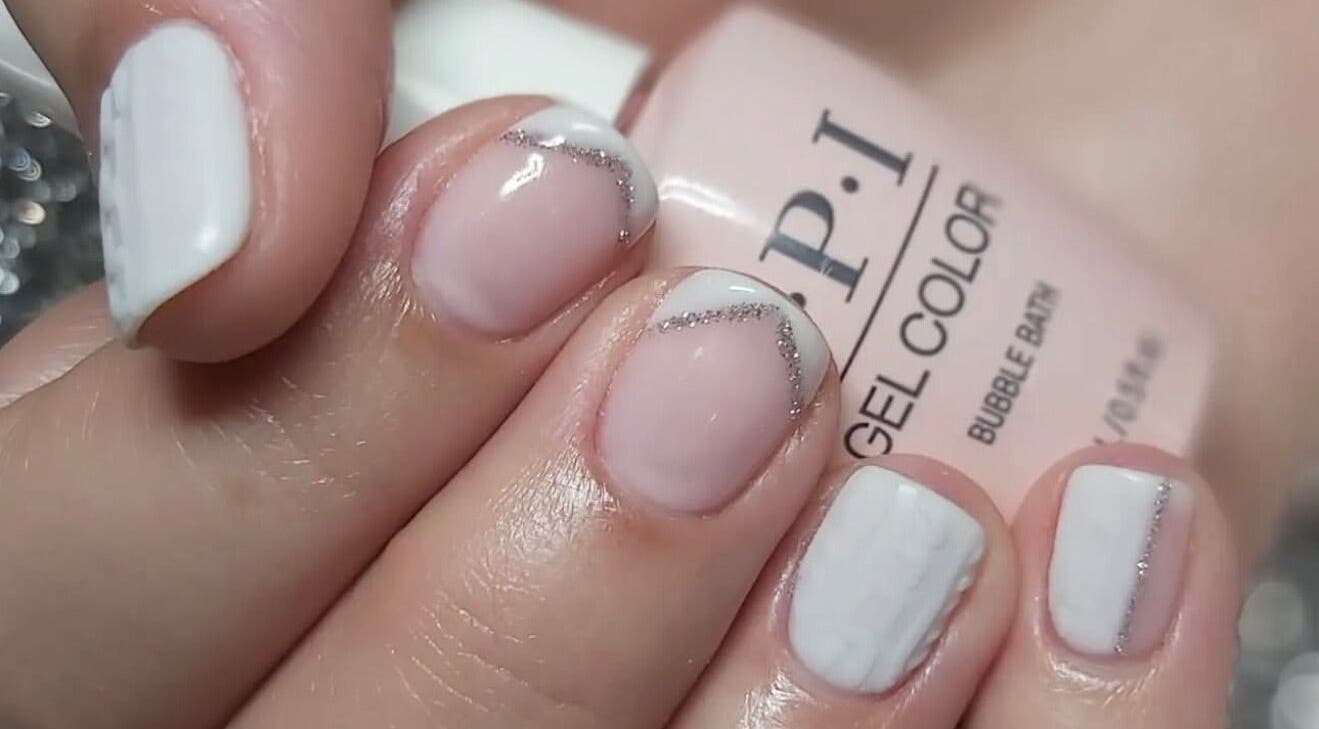 Elegant nail art at Hands & Heals by Tanya in Hamilton, Ontario, CA. Features soft pink and white polish.