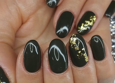 Elegant black and gold nail art at Hands & Heals by Tanya in Hamilton, Ontario, CA.