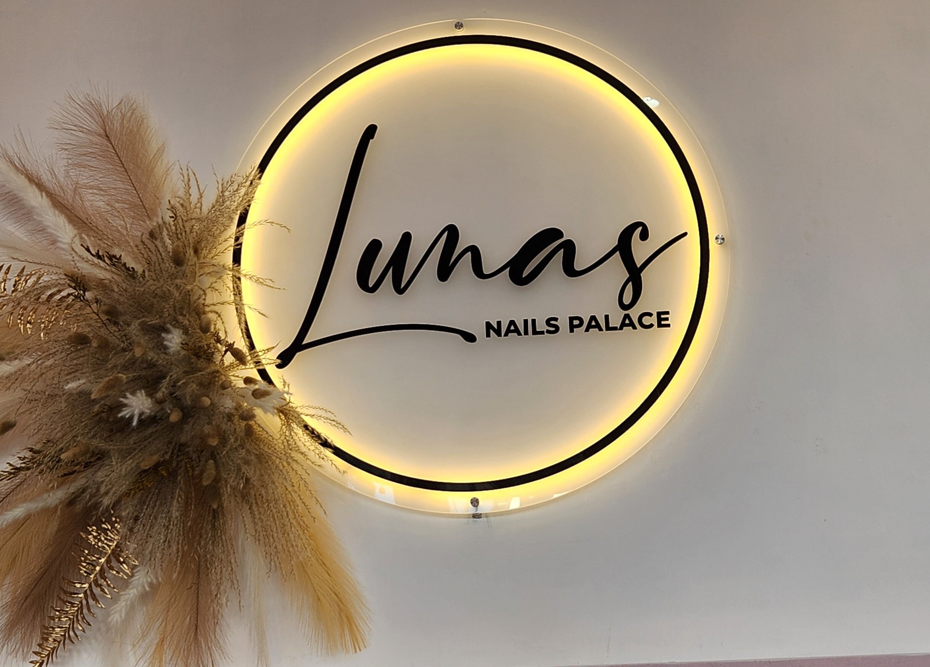 Lunas Nails Palace illuminated logo with floral decor in Walkerville, South Australia, AU.