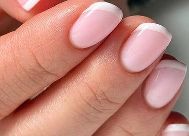 Elegant French manicure at ND Beauty Space, Hamilton, Ontario, CA, emphasizing subtle beauty and style.
