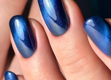 Elegant blue nails from ND Beauty Space in Hamilton, Ontario, CA showcasing shimmering nail art.