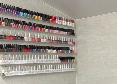 Colorful nail polish display at Dee Beauty Salon, Eastleigh, England, GB.