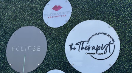 Eclipse Aesthetic Centre signage in Bloemfontein, Free State, ZA displayed on a lush green backdrop.