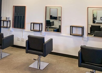 Modern salon chairs and mirrors at The Hair Company, Umhlanga, Kwazulu-natal, ZA.