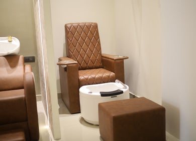 Luxurious pedicure station at Vintage Unisex Salon, Kochi, Kerala, IN, featuring plush seating.