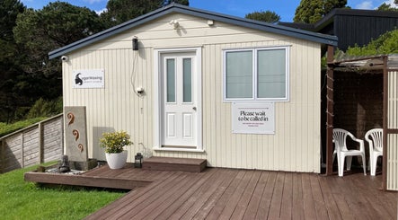 Front view of SugaZap Studio in Auckland, Auckland, NZ with a welcoming entrance and green surroundings.