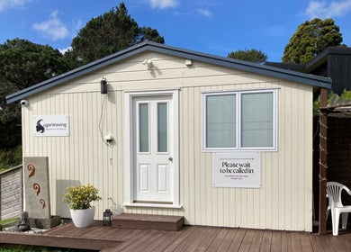 Entrance of Sugar Waxing Beauty Studio & Electrolysis in Auckland, Auckland, NZ with welcoming decor and greenery.
