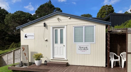 Entrance of Sugar Waxing Beauty Studio & Electrolysis in Auckland, Auckland, NZ with welcoming decor and greenery.