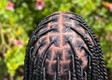 Intricate braided hair design at SlayedbyKy, Brighton, St. George, VC, showcasing detailed styling.