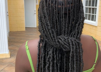 Intricate twisted hairstyle by SlayedbyKy at Brighton, St. George, VC showcasing expert styling.