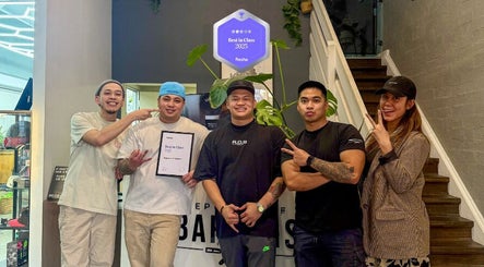 Team celebrating Best in Class award at Republic Of Barbers, Malvern, South Australia, AU.