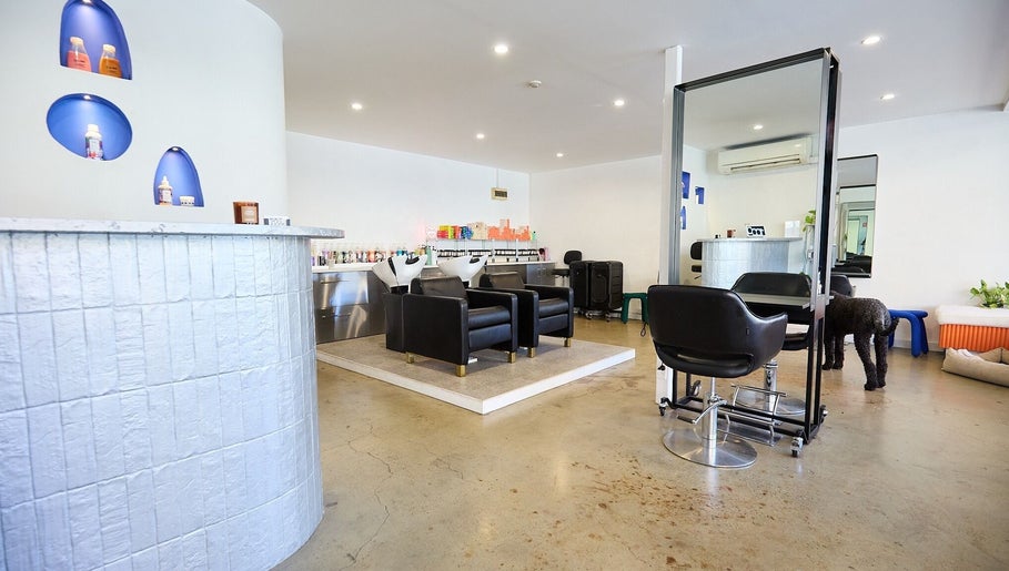 Chic salon interior at Chad Wij in Newtown, New South Wales, AU, showcasing modern chairs and sleek design.