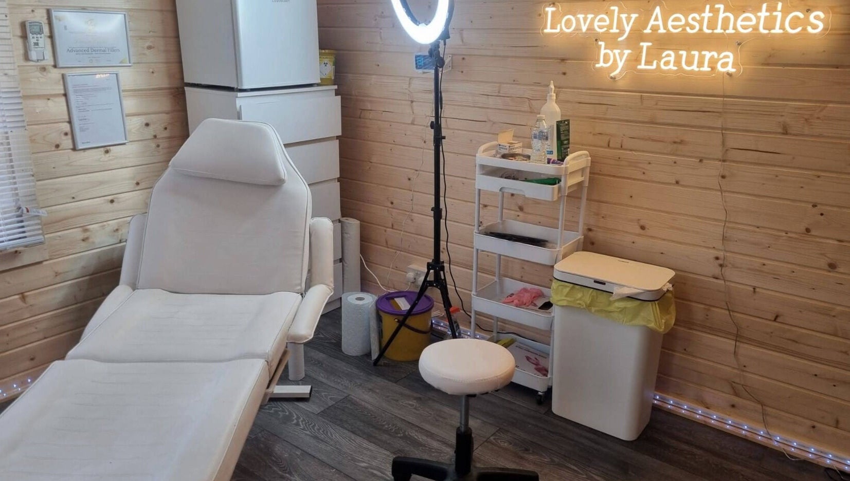Cozy treatment room at Lovely Aesthetics by Laura, Epsom, England, GB, featuring a comfortable chair.