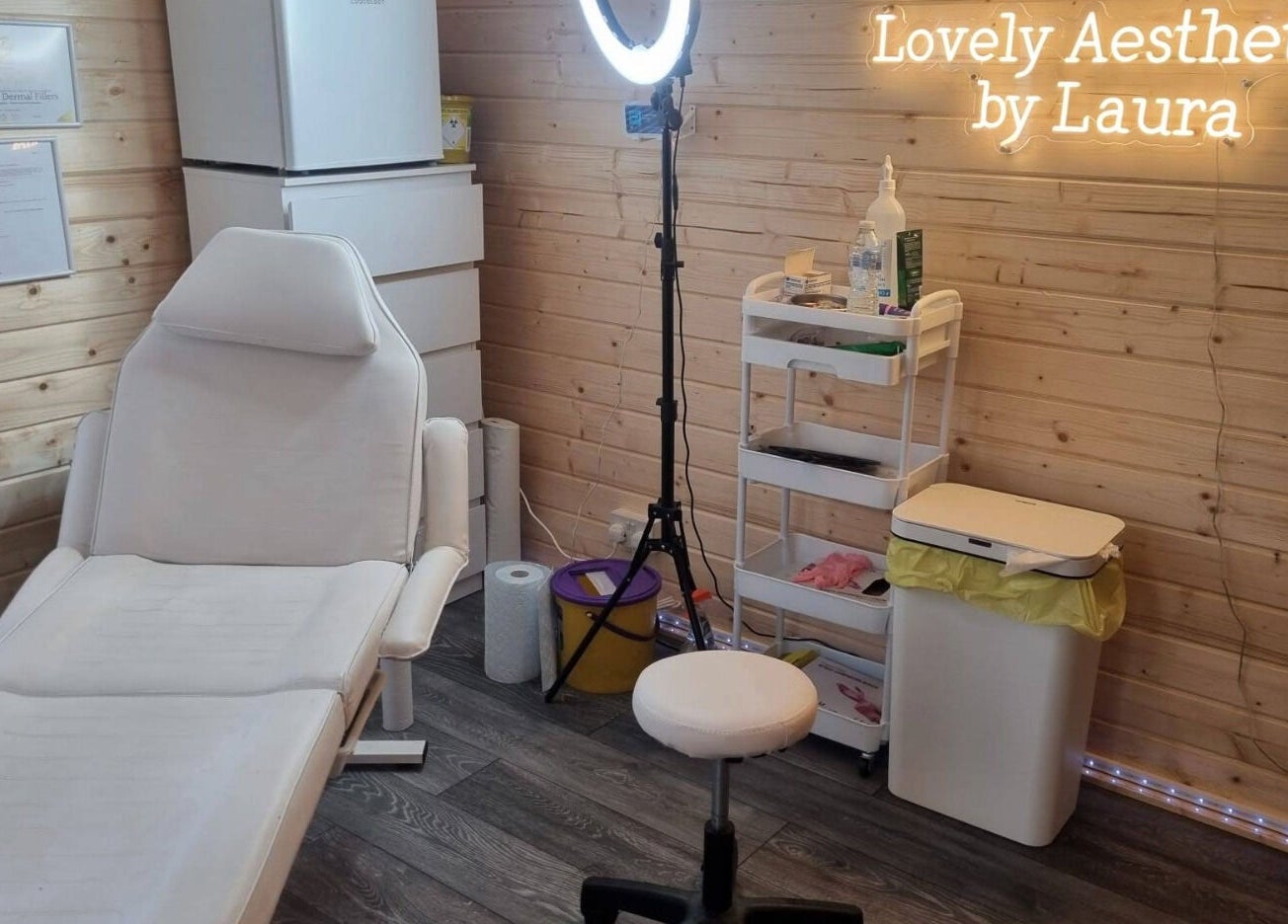 Cozy treatment room at Lovely Aesthetics by Laura, Epsom, England, GB, featuring a comfortable chair.