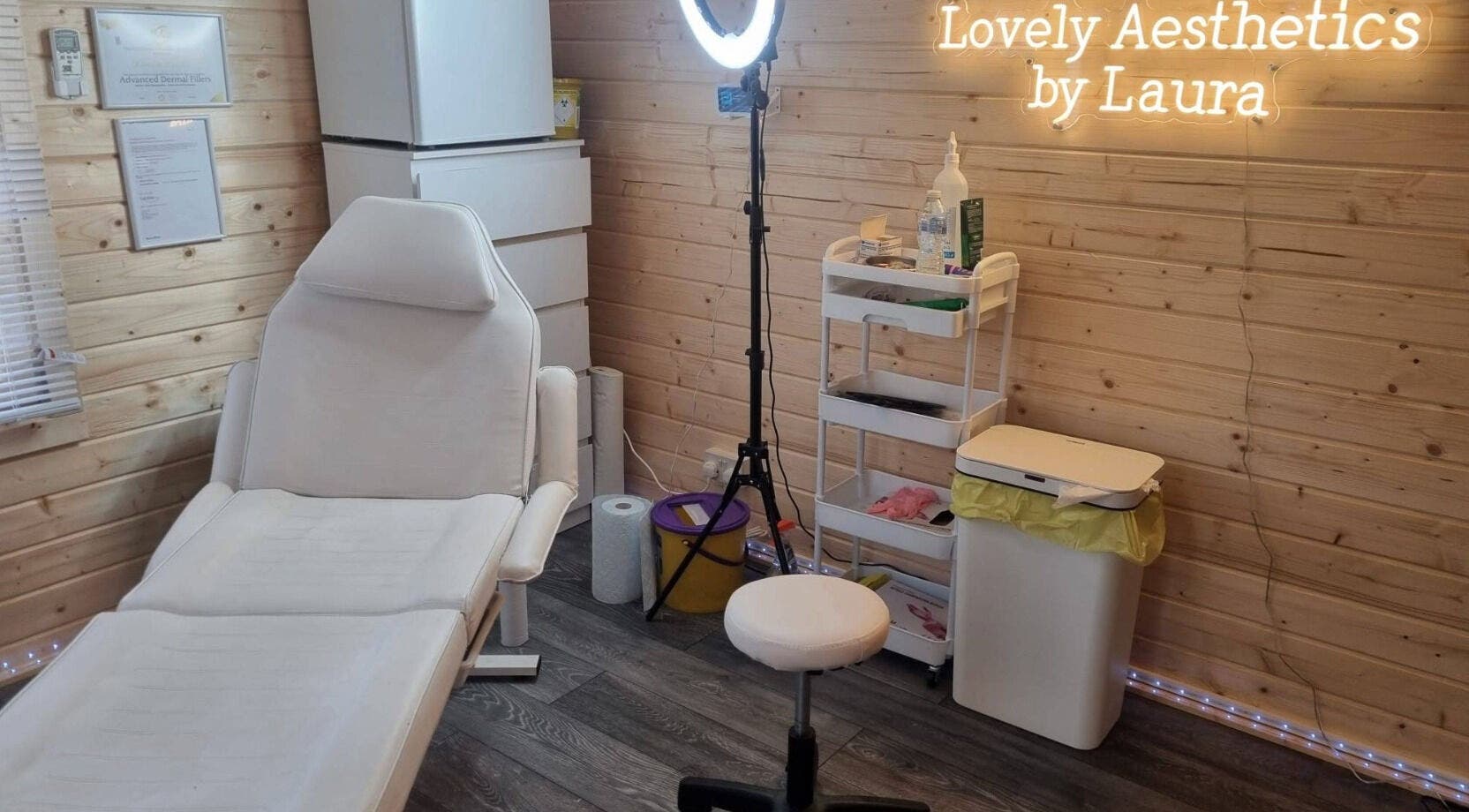 Cozy treatment room at Lovely Aesthetics by Laura, Epsom, England, GB, featuring a comfortable chair.