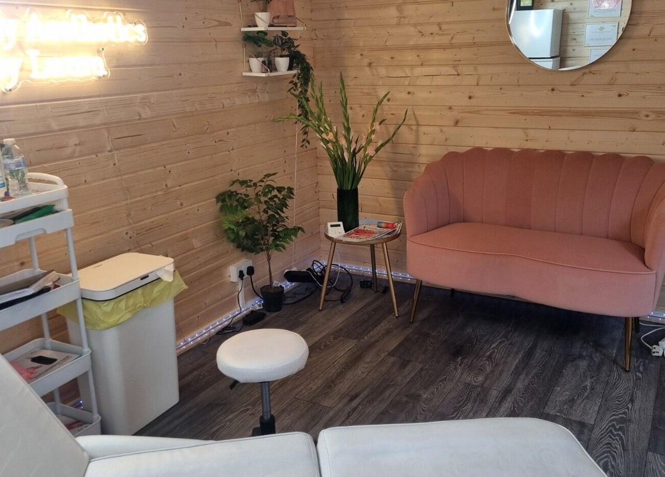 Lovely Aesthetics by Laura in Epsom, England, GB, featuring a chic pink sofa and serene decor.