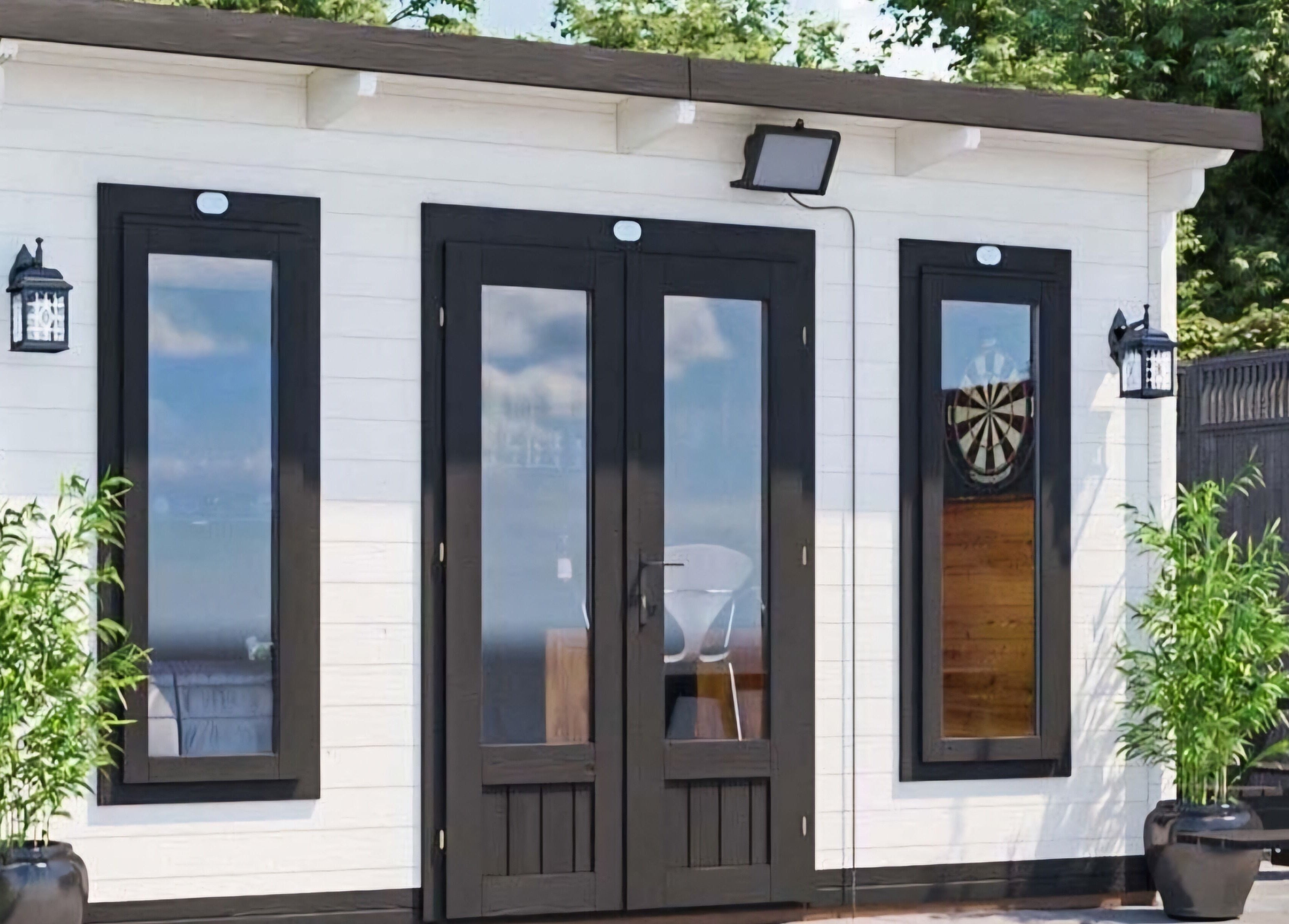 Modern studio exterior at Lovely Aesthetics by Laura, Epsom, England, GB nestled in tranquil greenery.