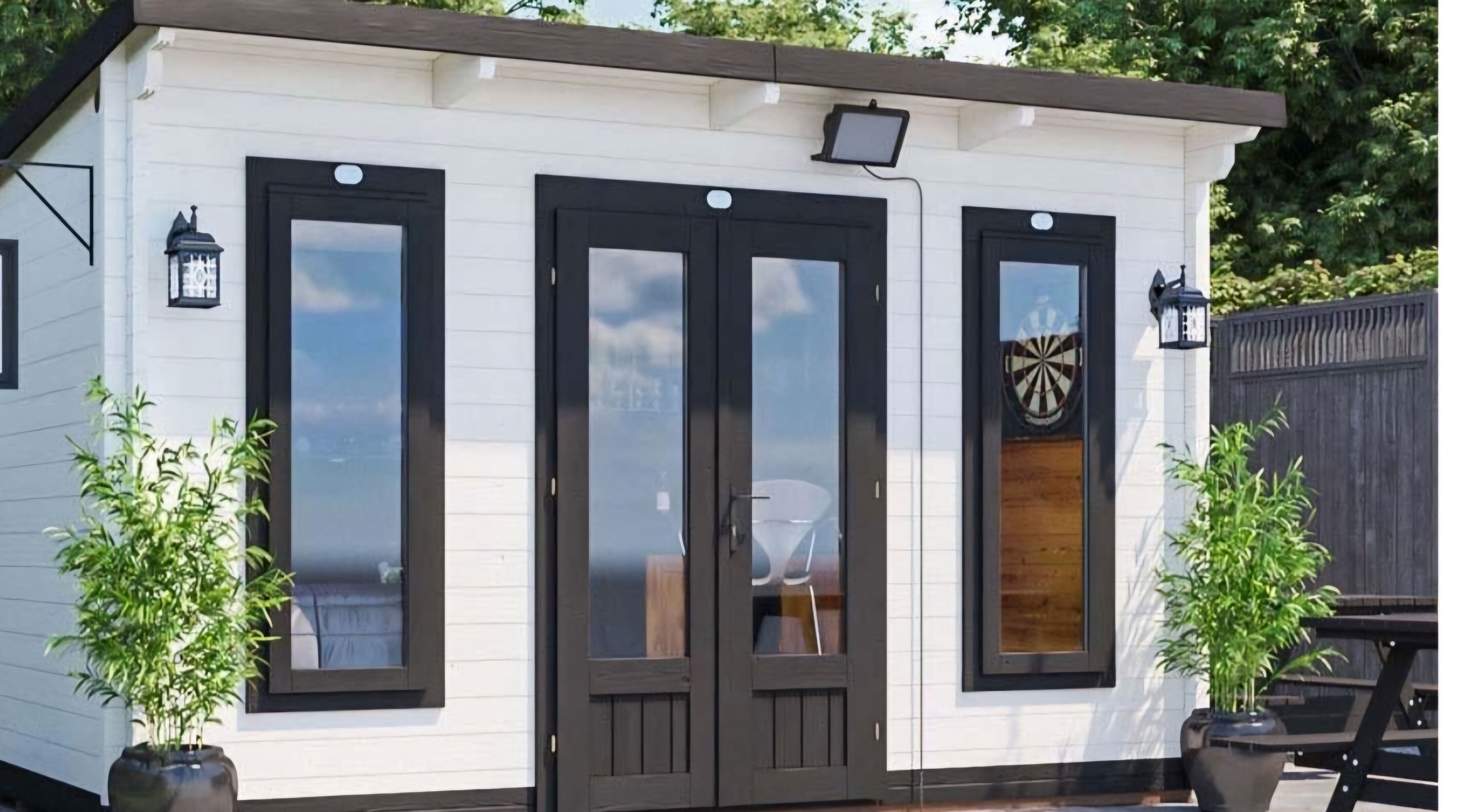 Modern studio exterior at Lovely Aesthetics by Laura, Epsom, England, GB nestled in tranquil greenery.