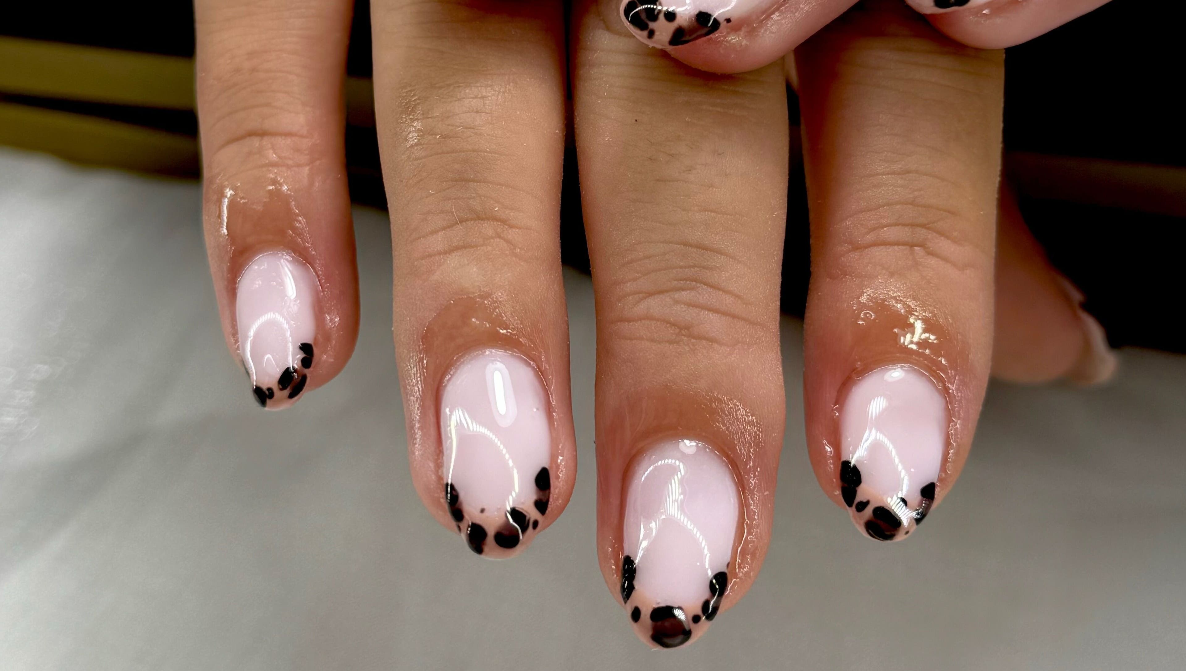 Stylish black and pink nail art at STUDIO 68 Hair & Nails, Portsmouth, England, GB.