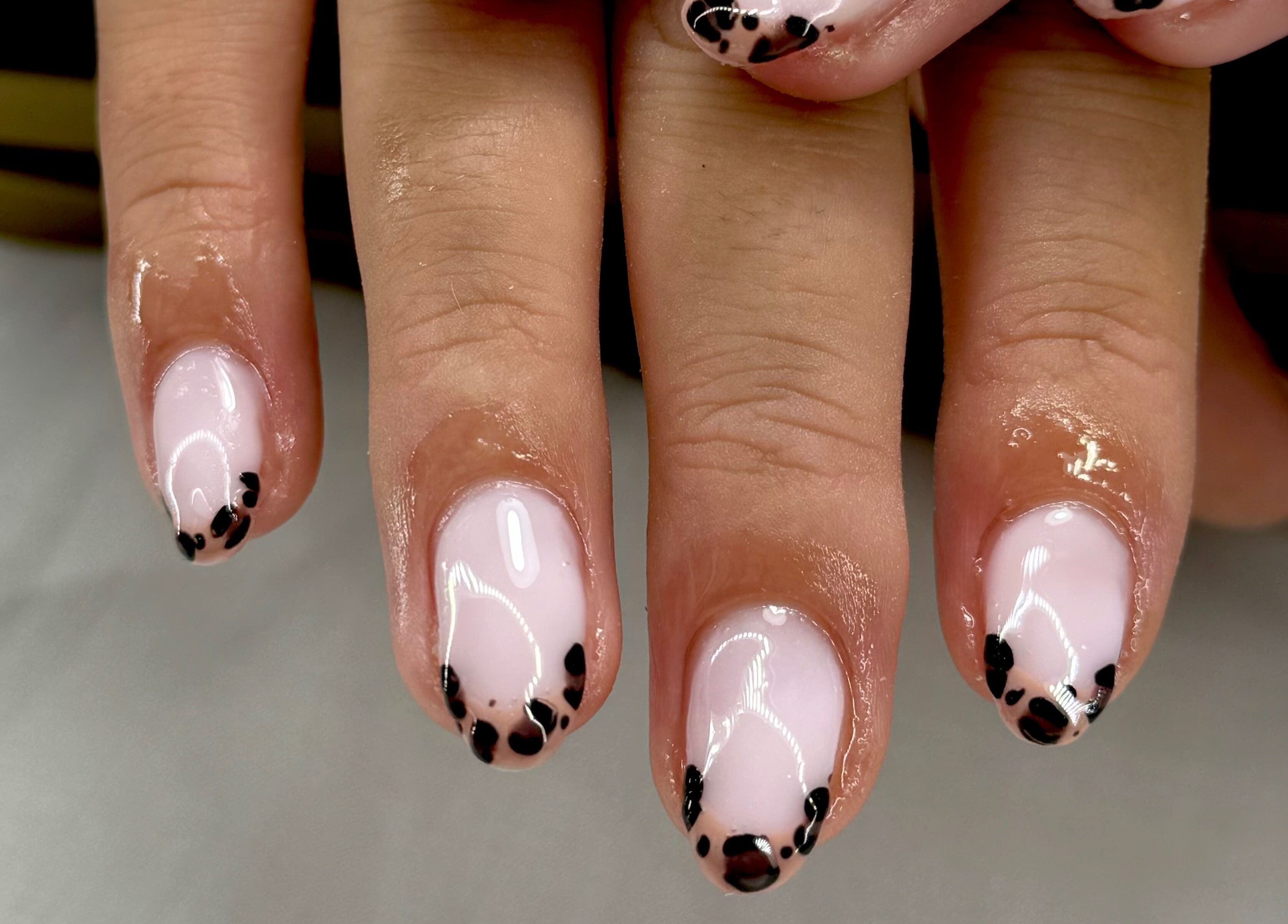 Stylish black and pink nail art at STUDIO 68 Hair & Nails, Portsmouth, England, GB.