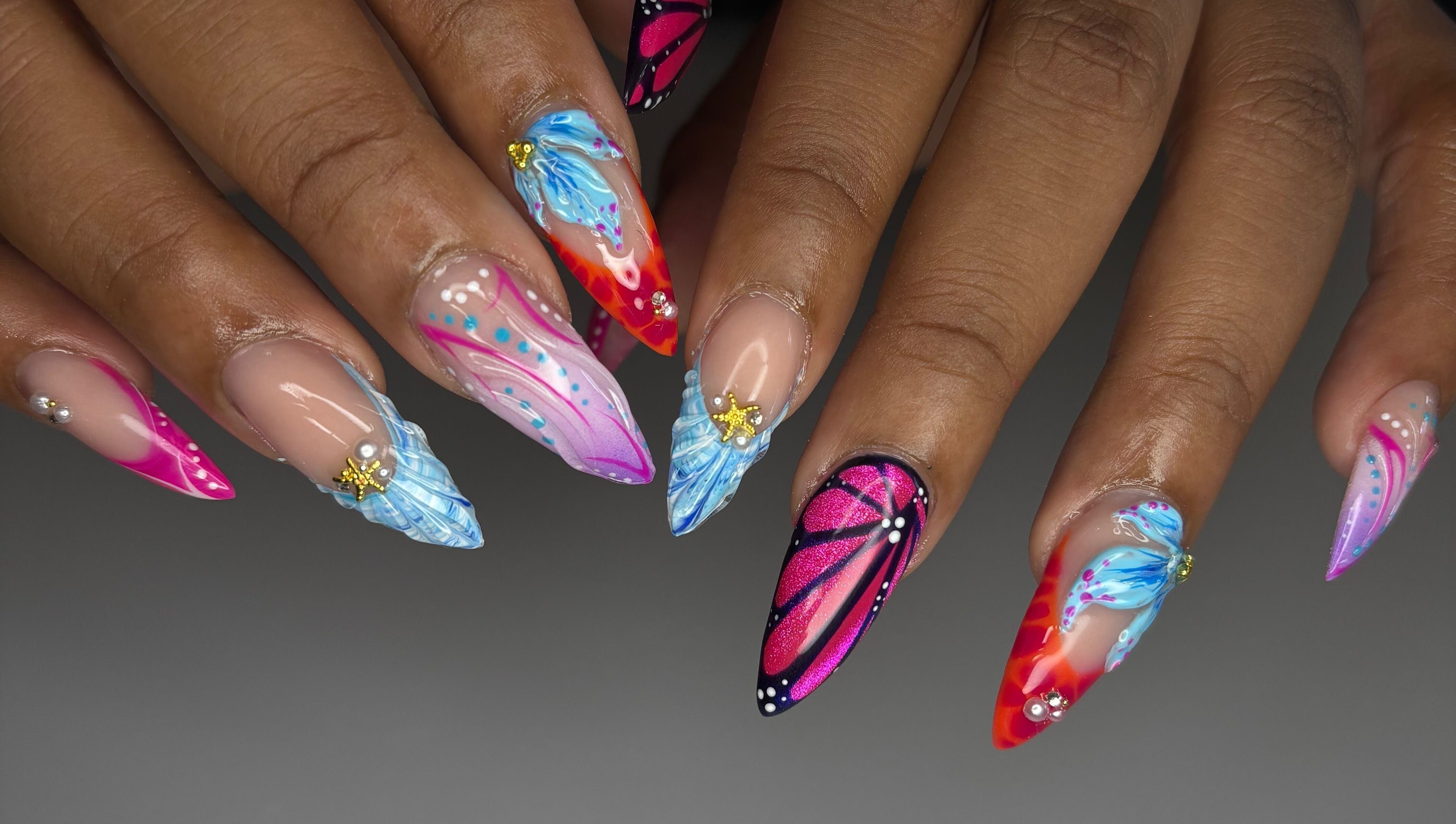 Vibrant nail art by Designed by Ry in Toronto, Ontario, CA, showcasing colorful and intricate designs.