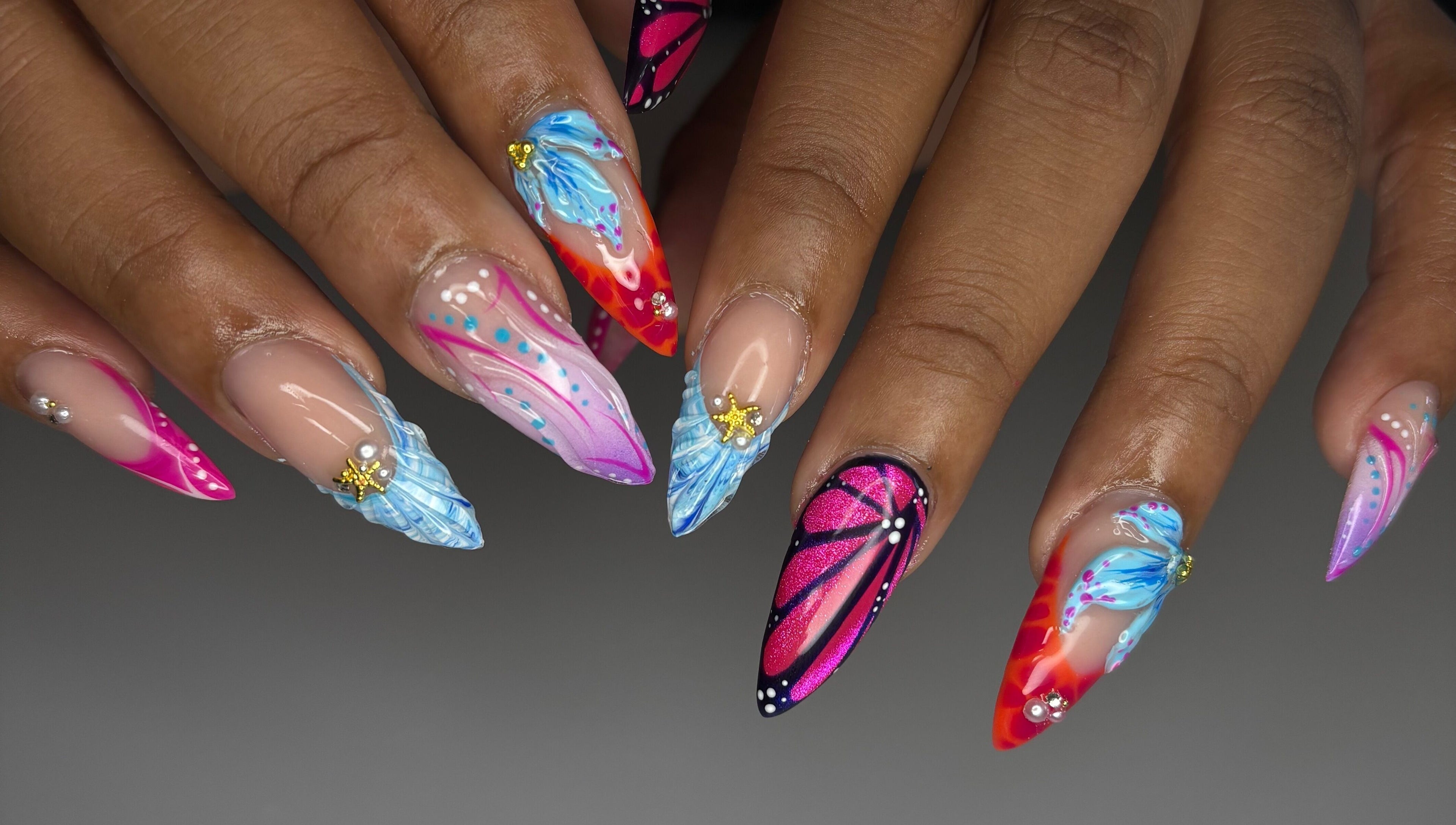 Vibrant nail art by Designed by Ry in Toronto, Ontario, CA, showcasing colorful and intricate designs.