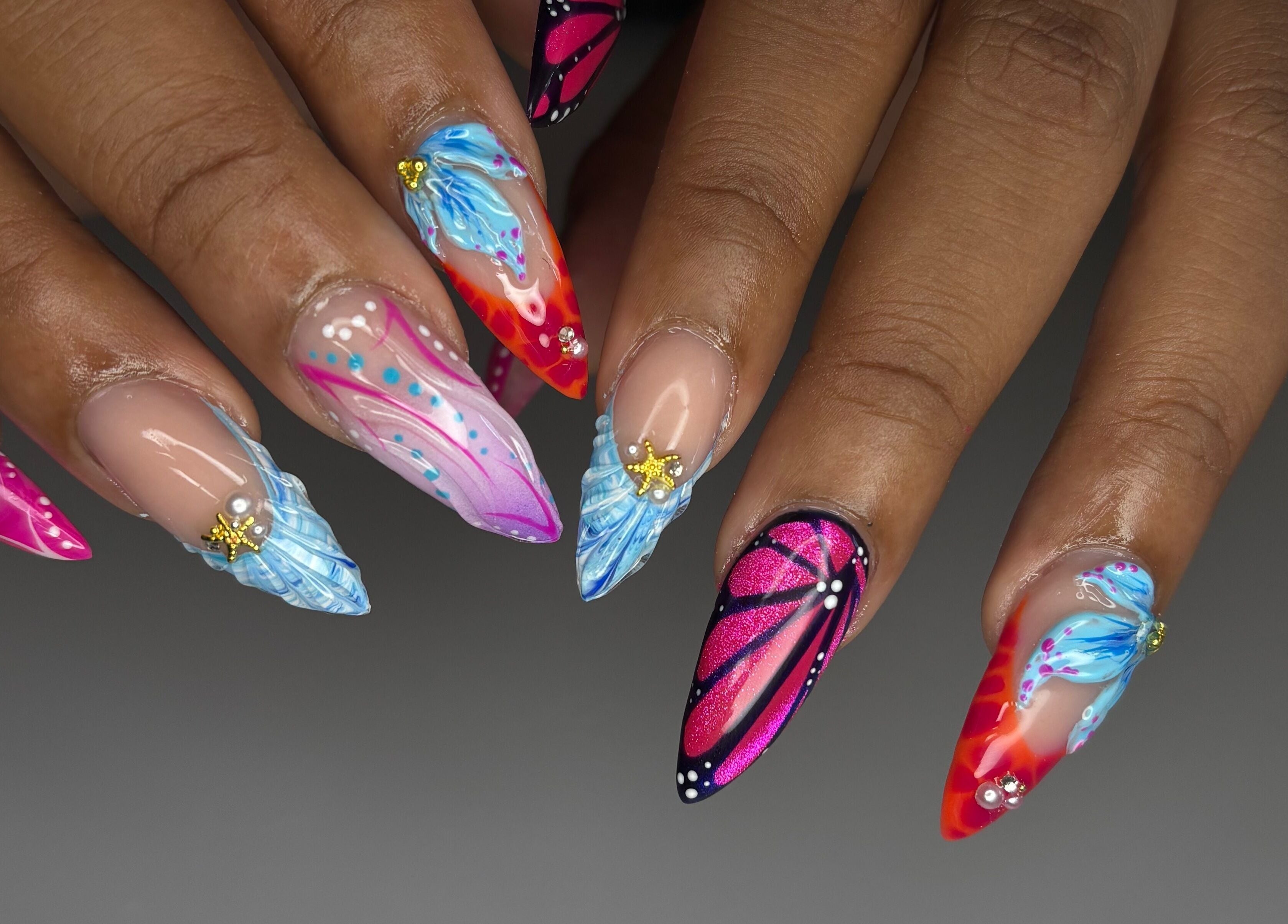 Vibrant nail art by Designed by Ry in Toronto, Ontario, CA, showcasing colorful and intricate designs.