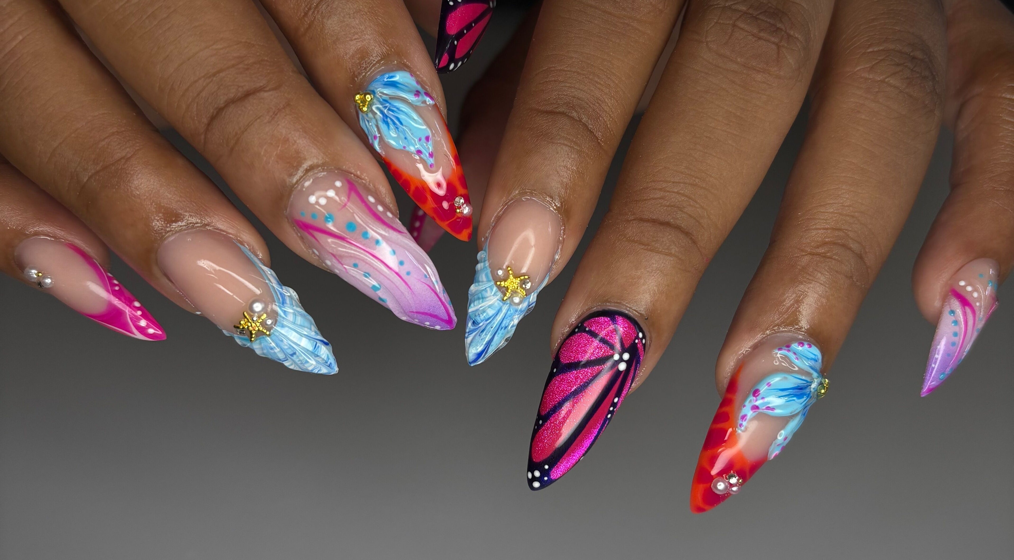 Vibrant nail art by Designed by Ry in Toronto, Ontario, CA, showcasing colorful and intricate designs.