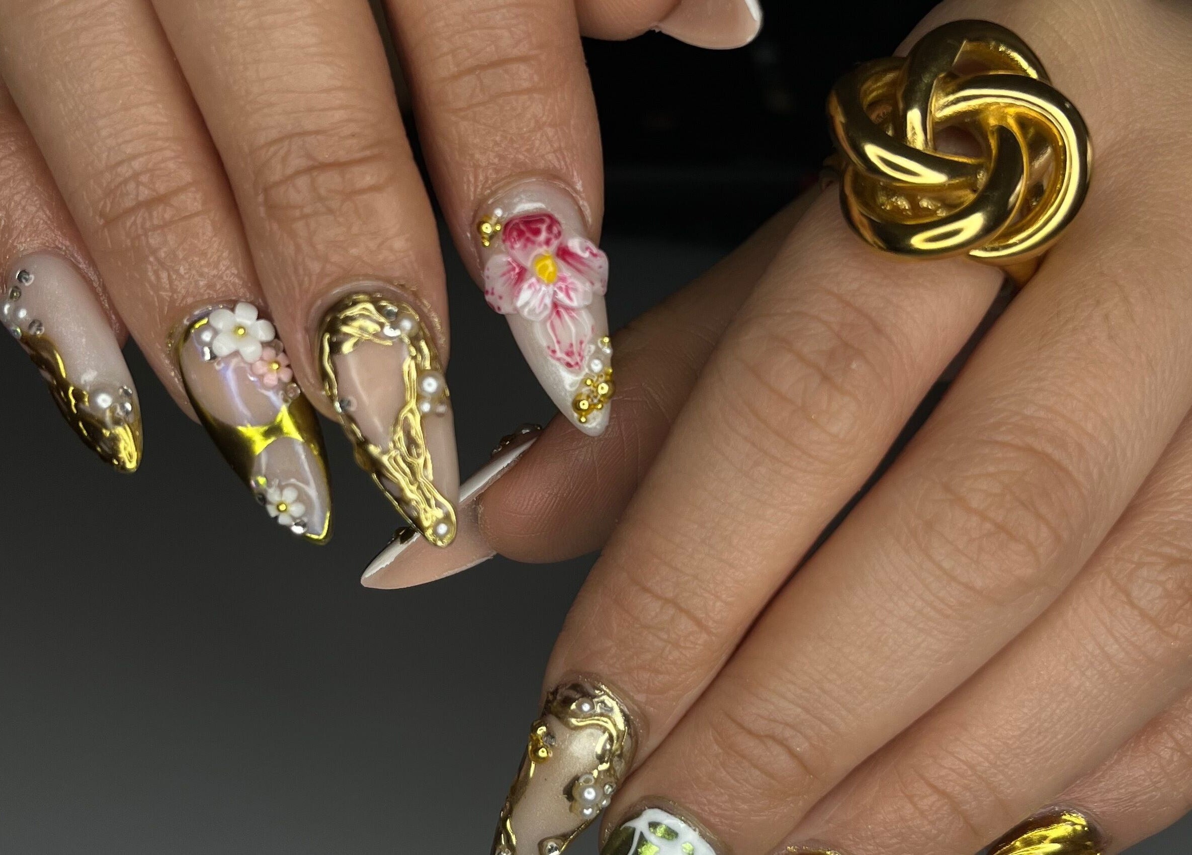 Detailed nail art with golden accents by Designed by Ry, Toronto, Ontario, CA.
