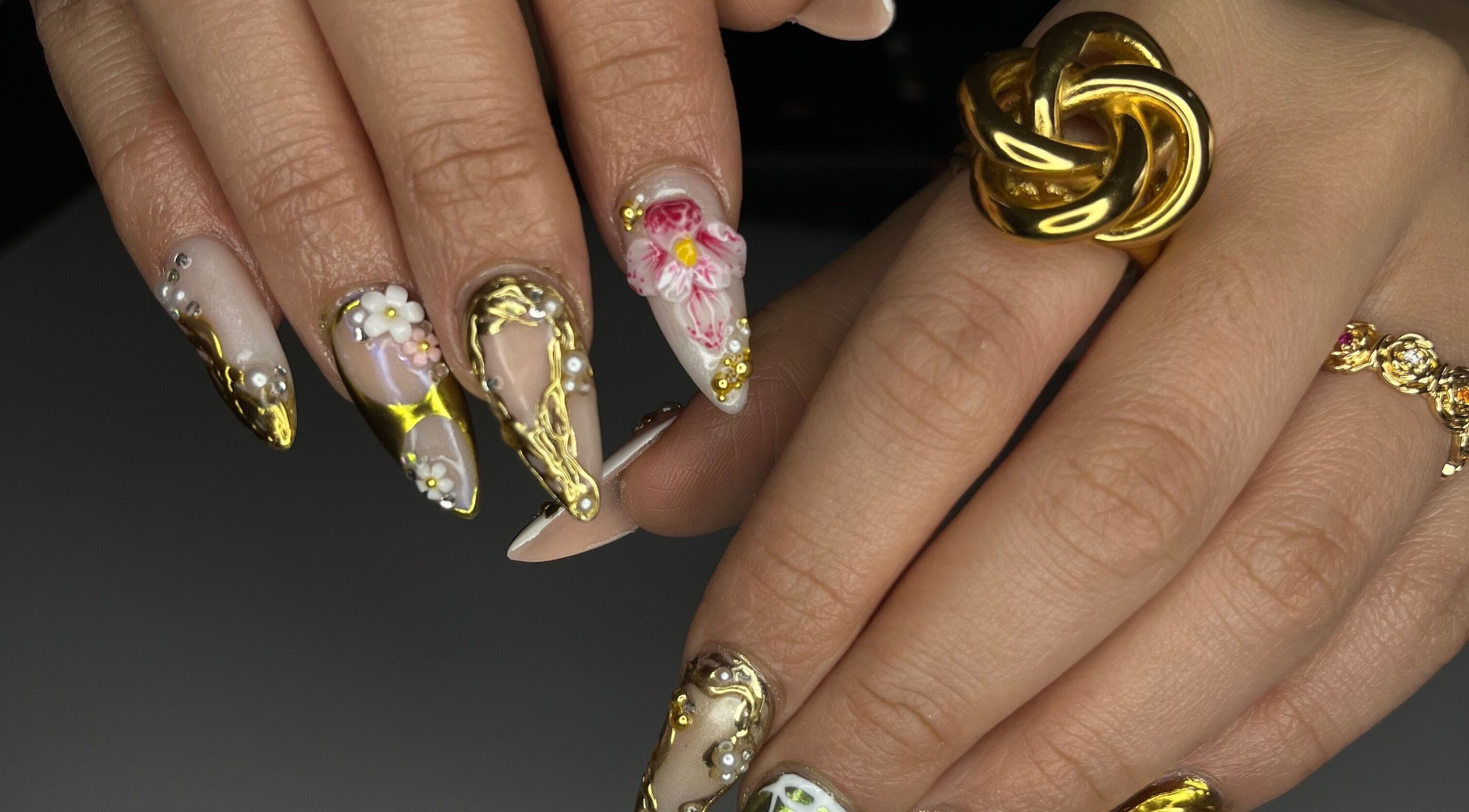 Detailed nail art with golden accents by Designed by Ry, Toronto, Ontario, CA.