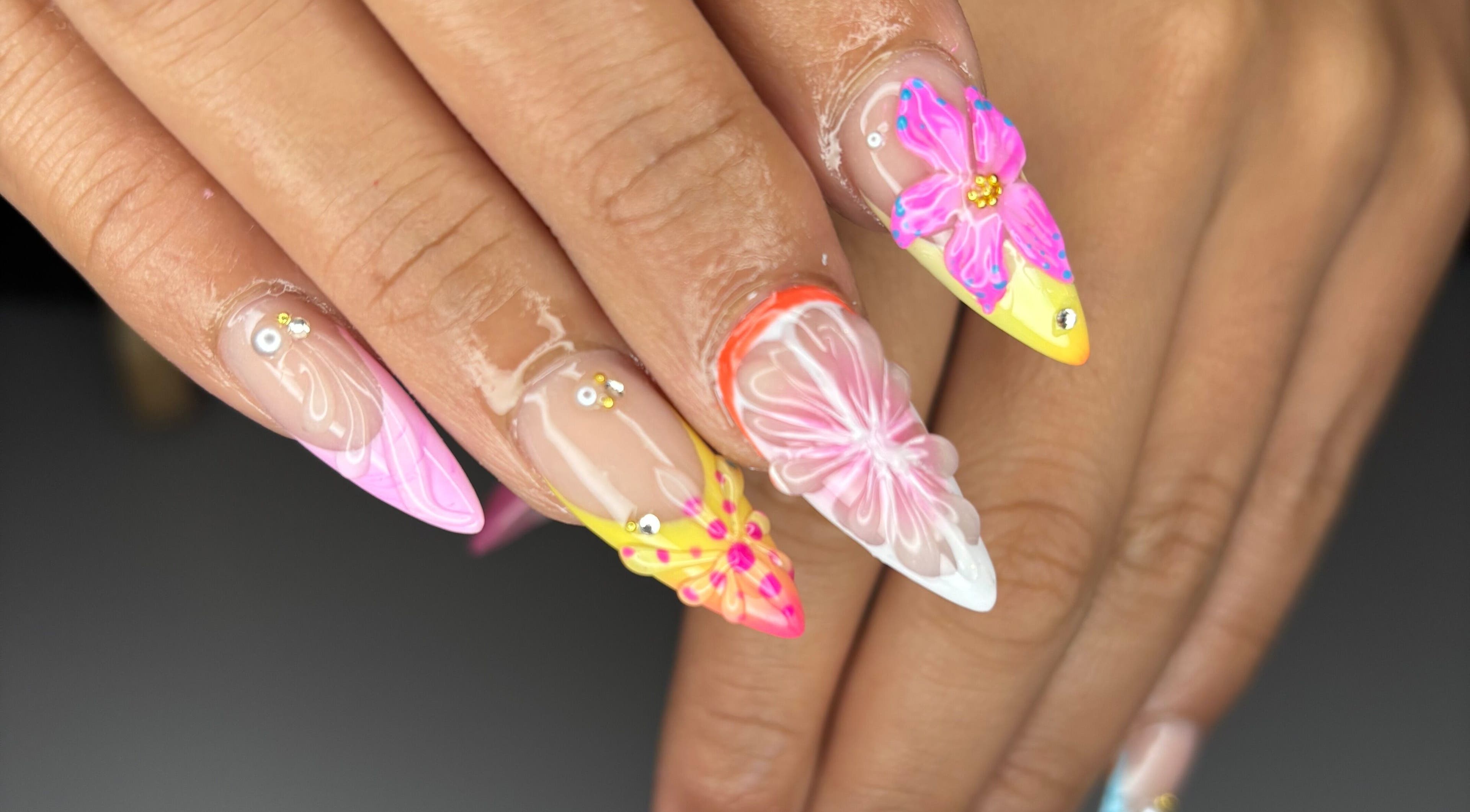 Vibrant floral nail art design by Designed by Ry, Toronto, Ontario, CA, showcasing detailed petals.