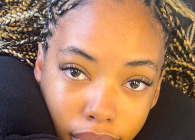 Client with stylish braids and lashes at Afia Beauty Studio, Randburg, Gauteng, ZA.