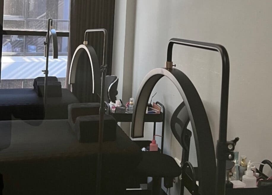 Relaxing treatment room at Afia Beauty Studio, Randburg, Gauteng, ZA, showcasing modern luxury and comfort.