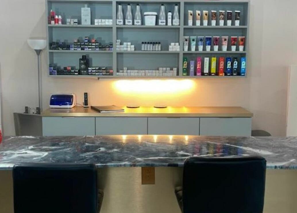 Modern salon interior at Boudoir hair concepts, Plano, Texas, US featuring product shelves and stylish decor.