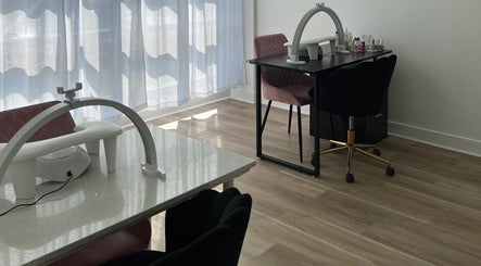 Modern nail station at Cloud Nine Beauty Studio in Tillsonburg, Ontario, CA with stylish seating and lighting.