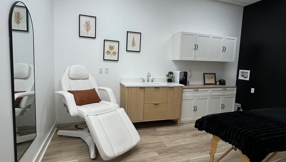 Elegant spa room at Cloud Nine Beauty Studio, Tillsonburg, Ontario, CA featuring a plush white chair and modern decor.